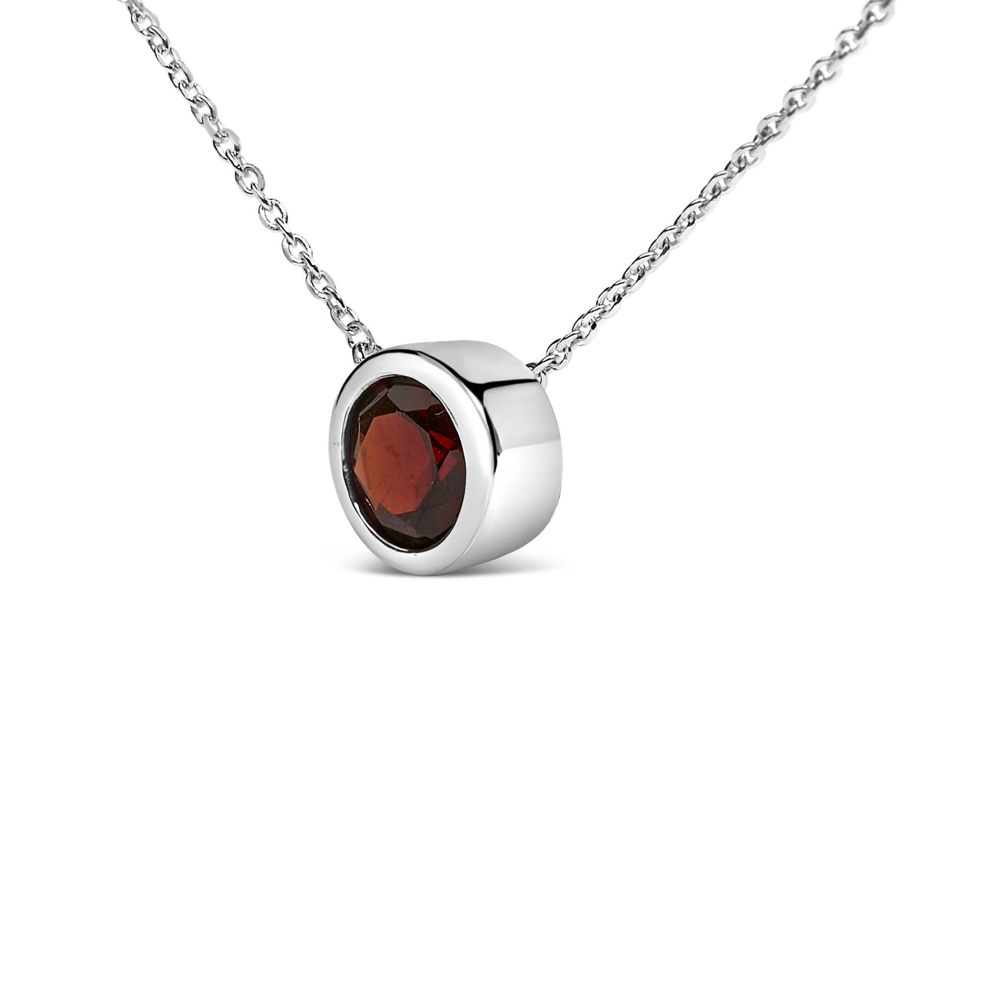 White metal necklace with a round red gemstone in a bezel setting, shown in a close-up front angle.