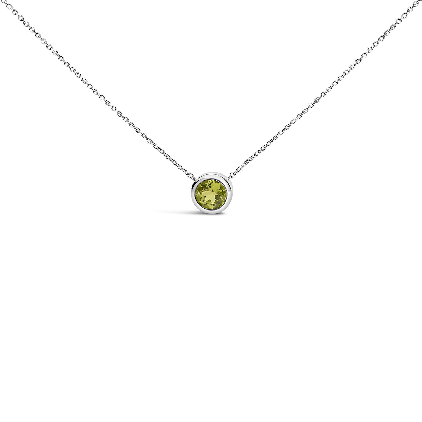 White necklace with a round green gemstone in a bezel setting, shown in a front-facing close-up shot.