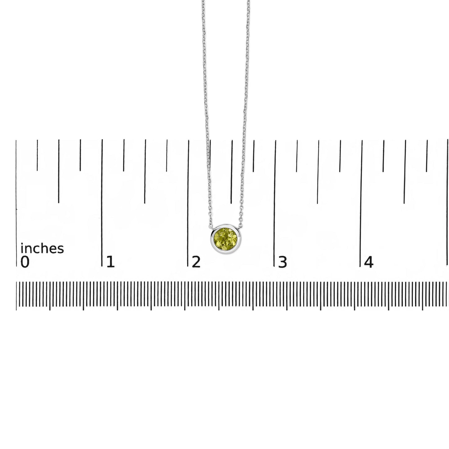 White necklace with a round green gemstone in bezel setting, shown hanging on a scale with the pendant centered, shot from the front.