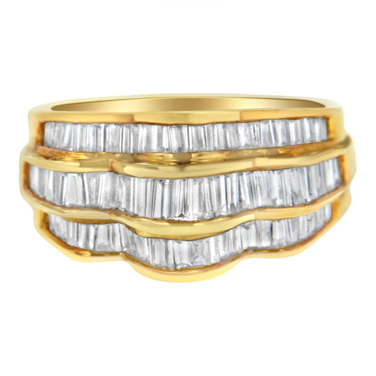Close-up front view of a yellow metal ring with three rows of channel-set white baguette-shaped gemstones.