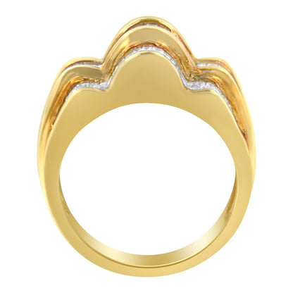 Front view of a yellow metal ring with a wavy design featuring a channel setting of white baguette-shaped gemstones.