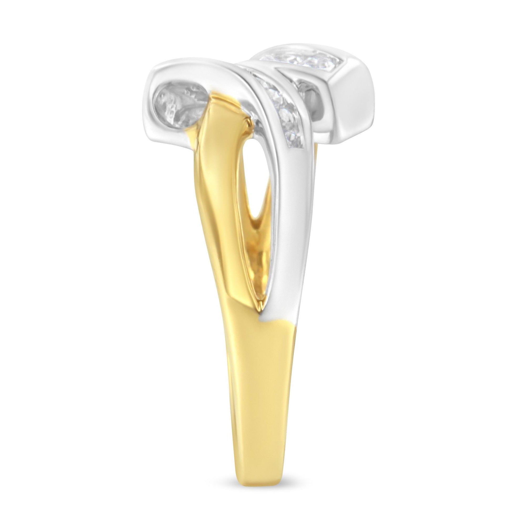 Side view of a two-toned ring with round white gemstones set in a channel setting on the upper part.