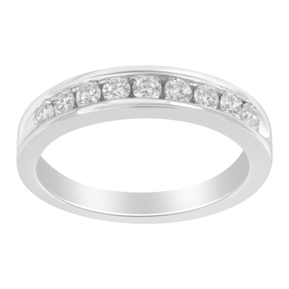 White metal ring with round white gemstones set in a channel, shown at a slight angle.