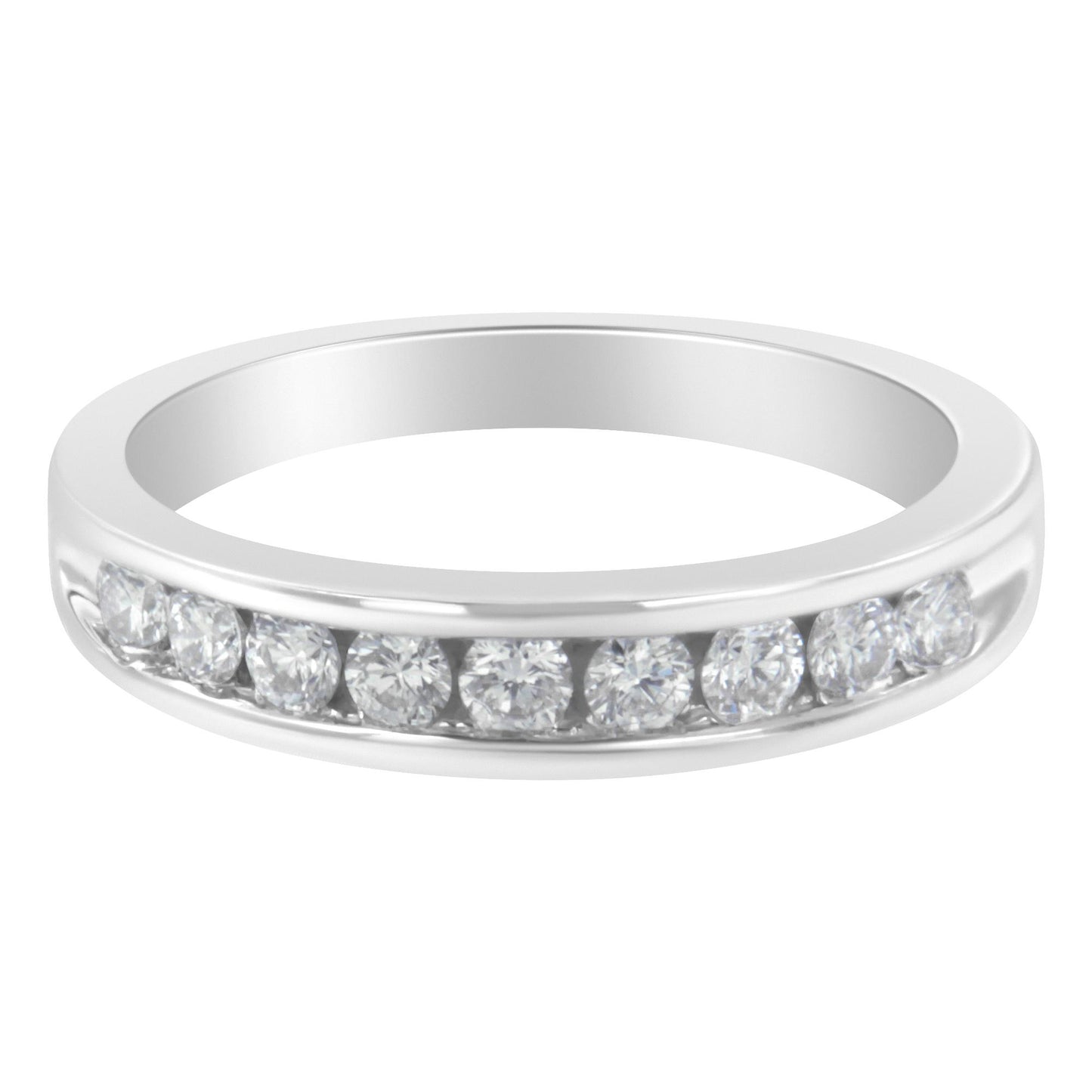 Front angle of a white metal ring featuring a channel setting of round white gemstones.