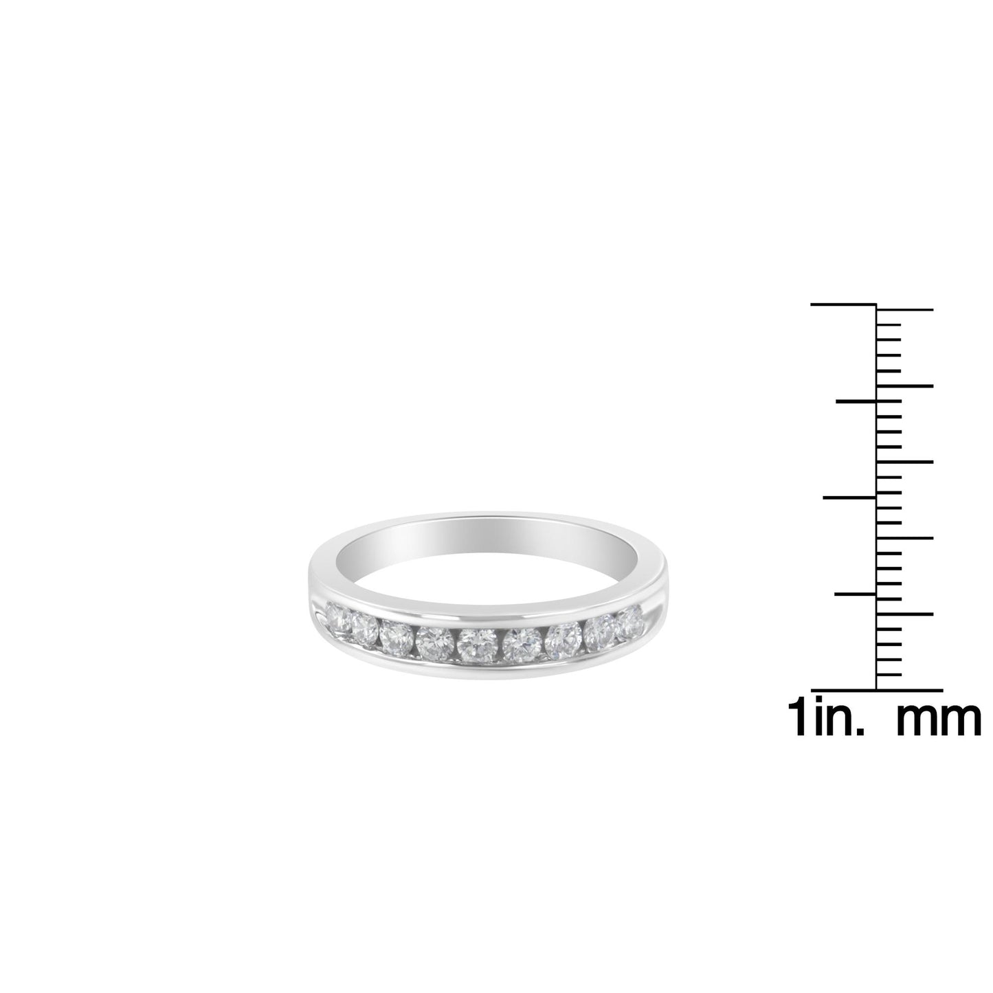 Front angled view of a white ring with a channel setting of round white gemstones, displayed next to a ruler for size reference.