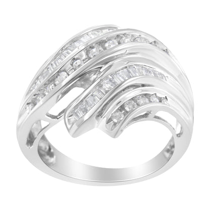White metal ring with alternating rows of round and baguette white gemstones in channel settings, shown from a side angle.