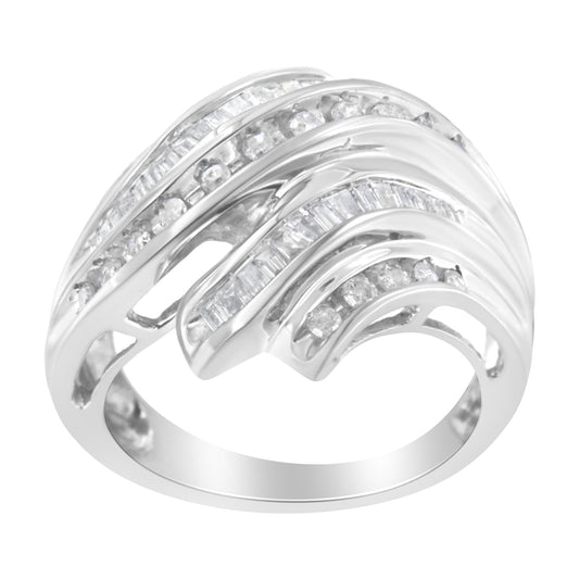 White metal ring with alternating rows of round and baguette white gemstones in channel settings, shown from a side angle.