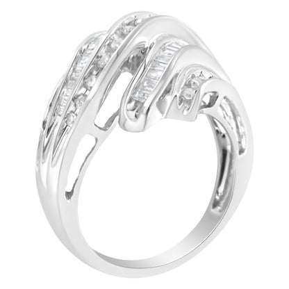White metal ring with channel-set round and baguette white gemstones, shown at an angled side view.