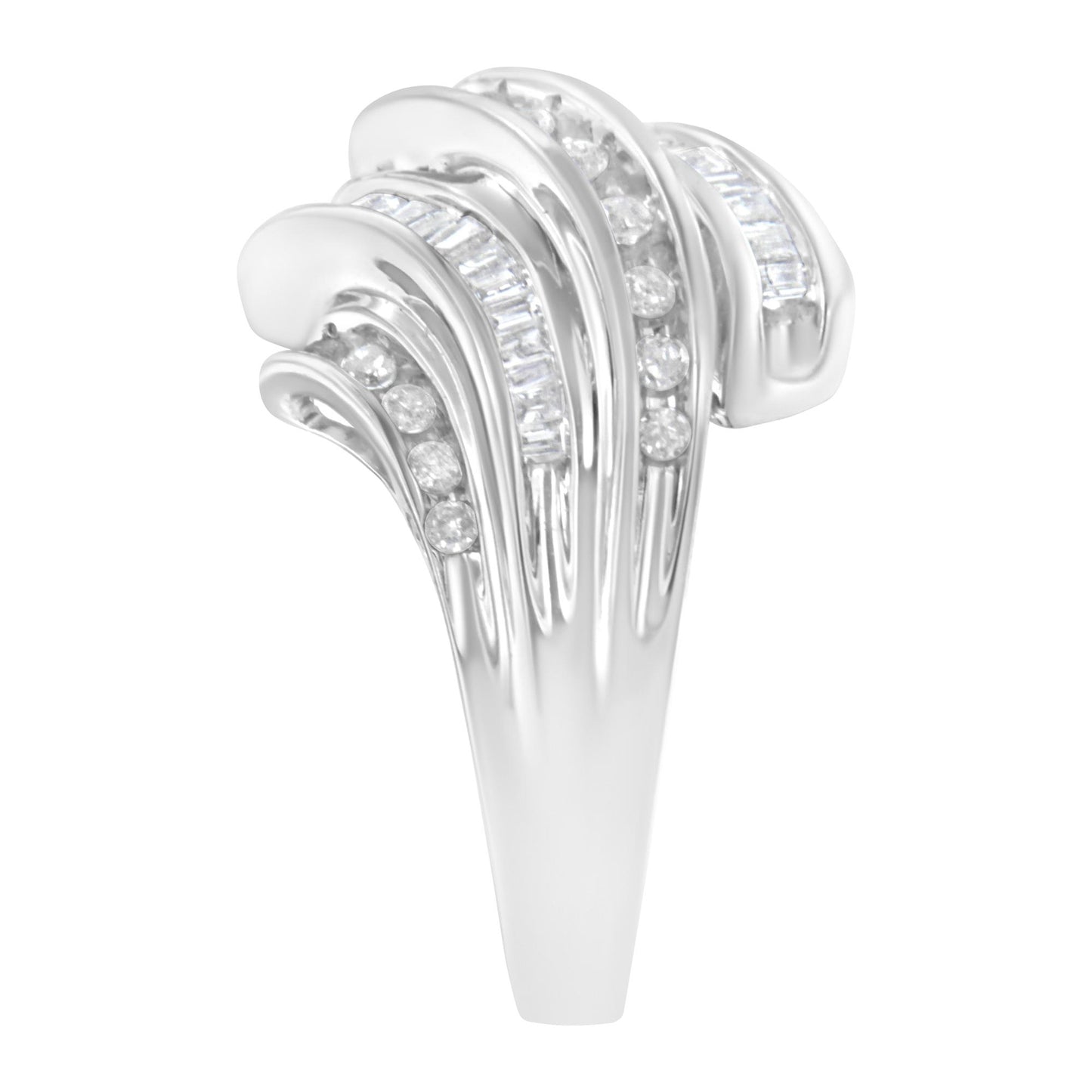 Close-up front view of a white metal ring featuring channel-set round and baguette-shaped white gemstones arranged in flowing, curved bands.