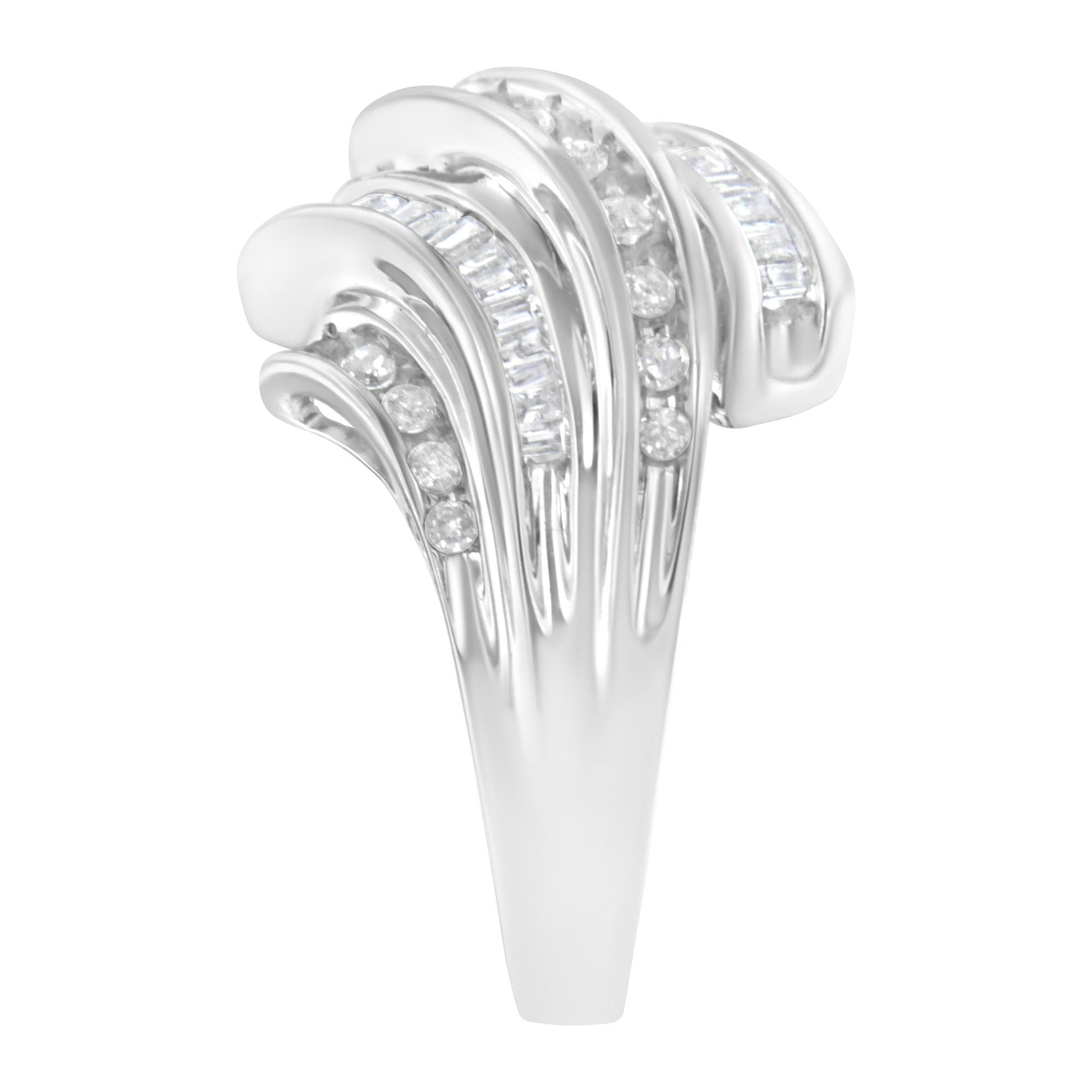 Close-up front view of a white metal ring featuring channel-set round and baguette-shaped white gemstones arranged in flowing, curved bands.
