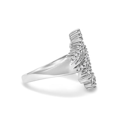 White metal ring shown from the side angle with a V-shaped top featuring round white gemstones in prong settings and baguette white gemstones in channel settings.
