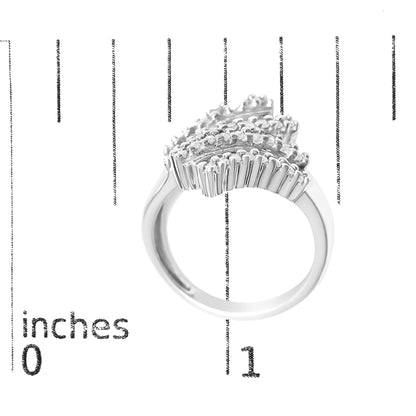 White metal ring shown on a scale, viewed from a side angle, featuring multiple rows of prong-set round white gemstones and channel-set baguette white gemstones arranged in a waved pattern.