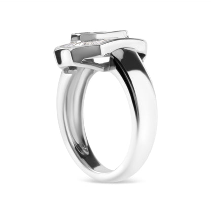 Side angle view of a white metal ring featuring a top row of baguette-shaped white gemstones in a channel setting and an elevated arrangement of princess-shaped white gemstones in an invisible setting.