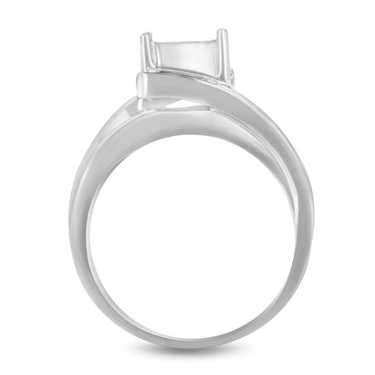 White metal ring with an elevated rectangular setting seen from the side angle.