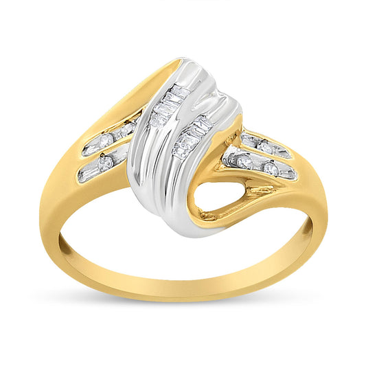 Two-toned ring with channel-set round and baguette white gemstones, shown at a slight angle.