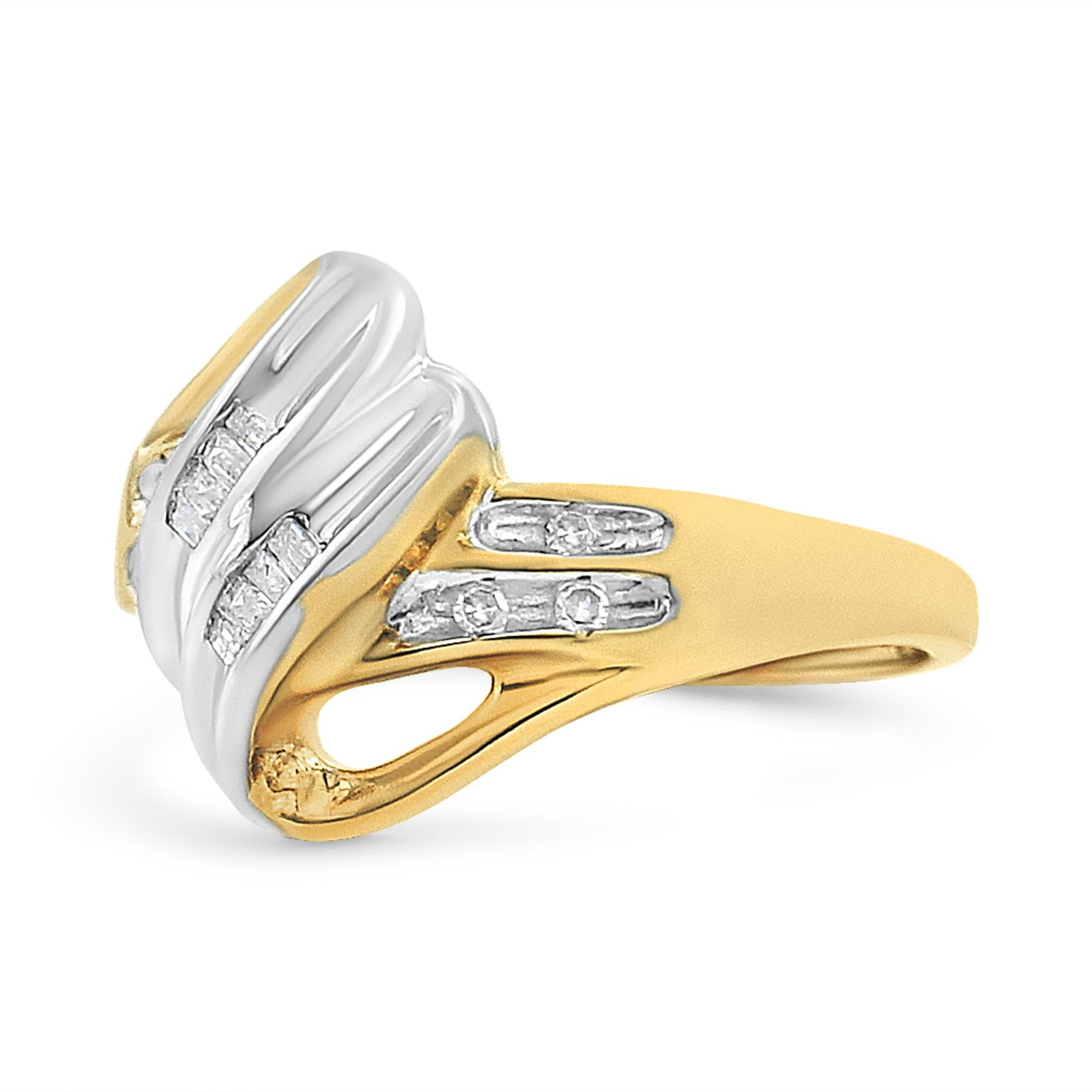Two-toned ring with white and yellow metal viewed from a front side angle, featuring channel-set white round and baguette-shaped gemstones.