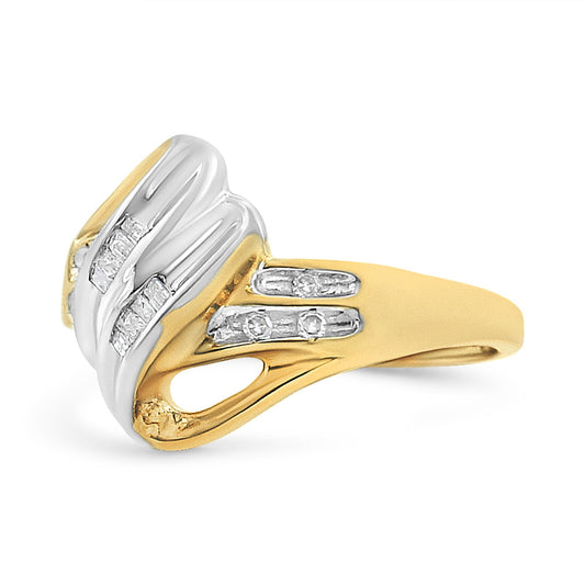 Two-toned ring with white and yellow metal viewed from a front side angle, featuring channel-set white round and baguette-shaped gemstones.