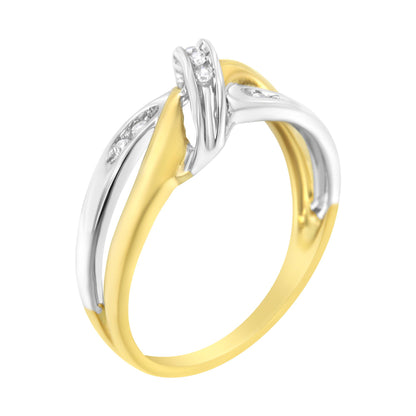 Two-toned ring with an intertwined design featuring channel-set round white gemstones, shown at an angle.