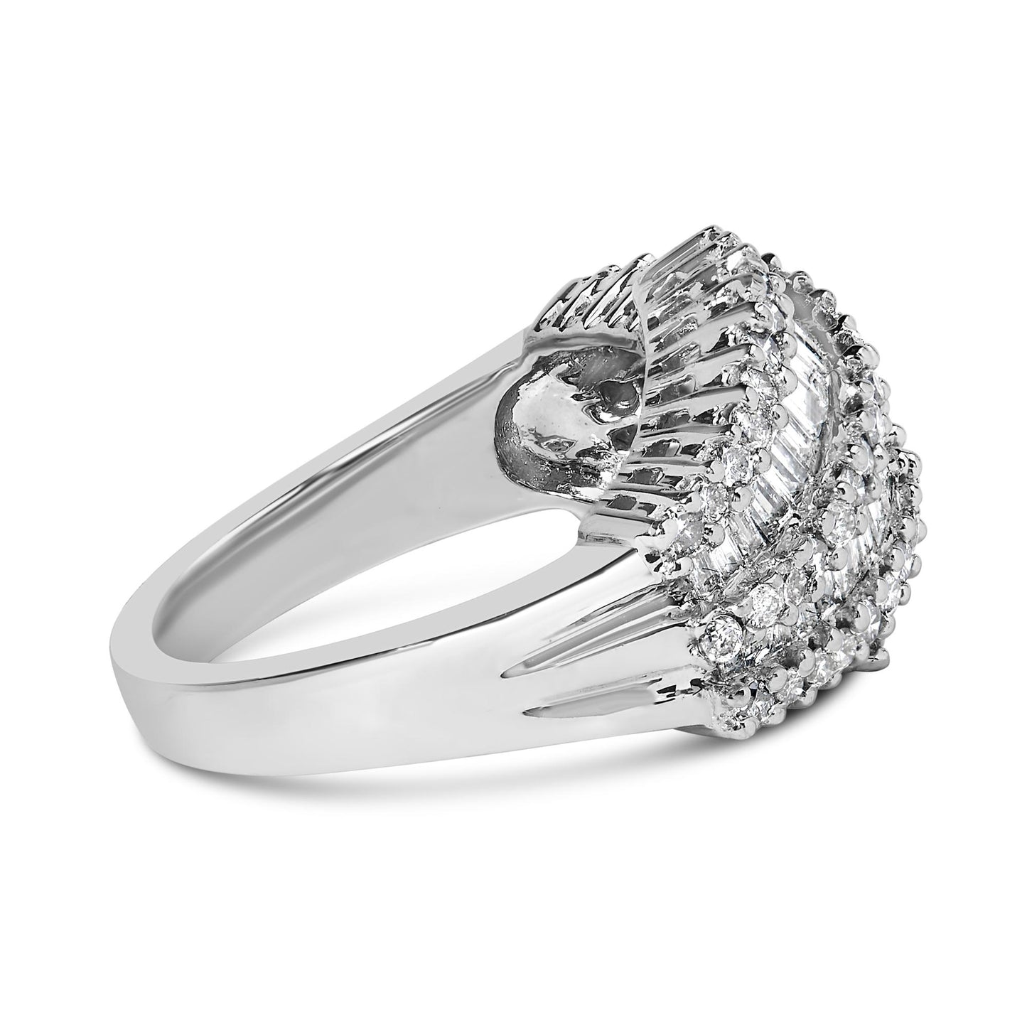 White metal ring with a raised cluster design featuring white round gemstones in prong settings surrounding white baguette gemstones in channel settings, shown at a side angle.