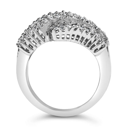 Close-up side view of a white metal ring featuring a curved row of white baguette gemstones in channel setting, bordered by white round gemstones in prong settings.