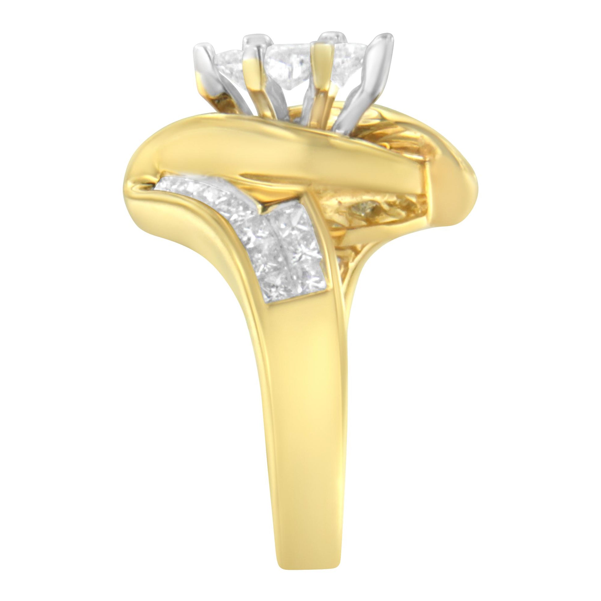 Yellow metal ring with a crossover design, featuring white gemstones in pie, princess, and baguette shapes set in channels, shown in a front close-up angle.