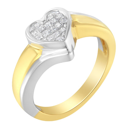 Close-up angled view of a two-tone ring with a yellow and white metal band, featuring a heart-shaped top set with multiple white princess-shaped gemstones in a channel setting.