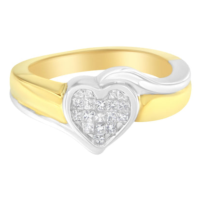 Close-up front angle of a two-tone ring with a heart-shaped cluster of white princess-cut gemstones set in a channel setting.