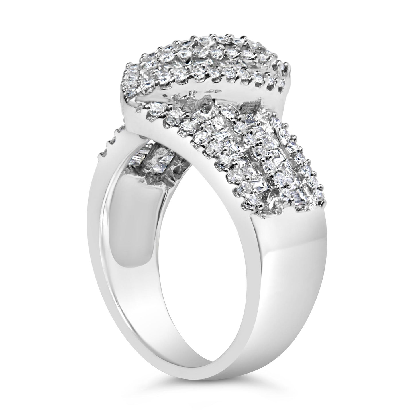 White metal ring with an overlapping design, featuring round prong-set white gemstones and baguette channel-set white gemstones, shown at an angled side view.