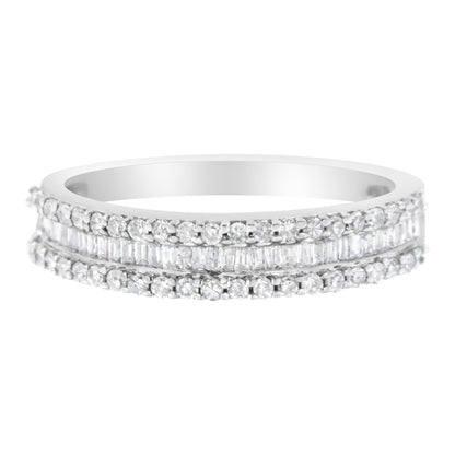 Front view of a white metal ring featuring two rows of round white gemstones in prong settings and one center row of baguette white gemstones in a channel setting.