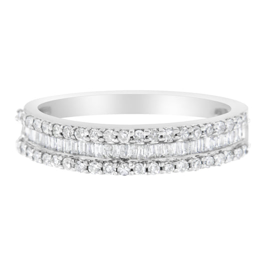 Front view of a white metal ring featuring two rows of round white gemstones in prong settings and one center row of baguette white gemstones in a channel setting.