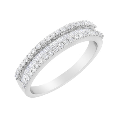 White metal ring with two rows of round white gemstones in prong settings flanking a center row of baguette white gemstones in channel setting, shown at a slight angle.