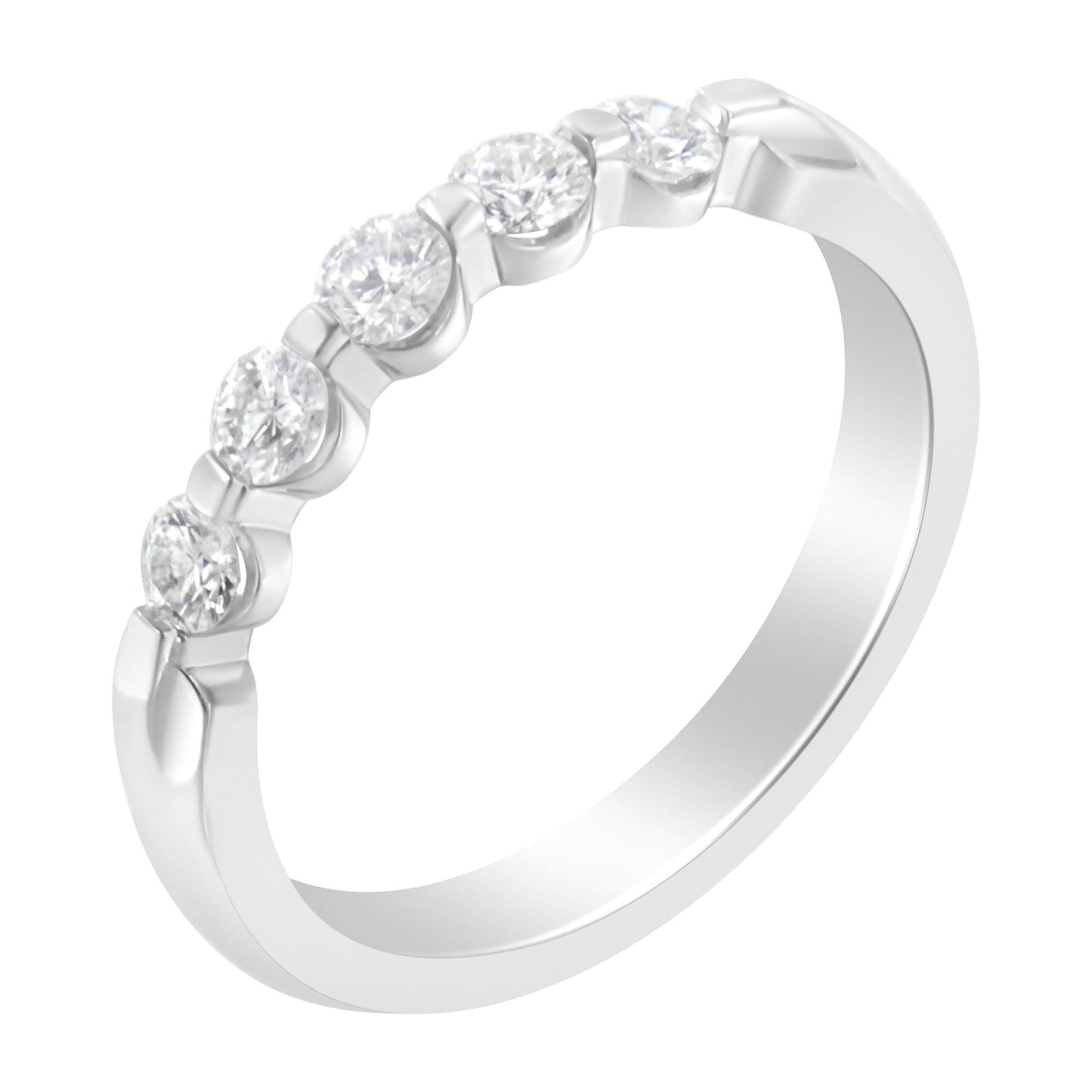 White metal ring with five round white gemstones in a channel setting, shown at a slight angle.