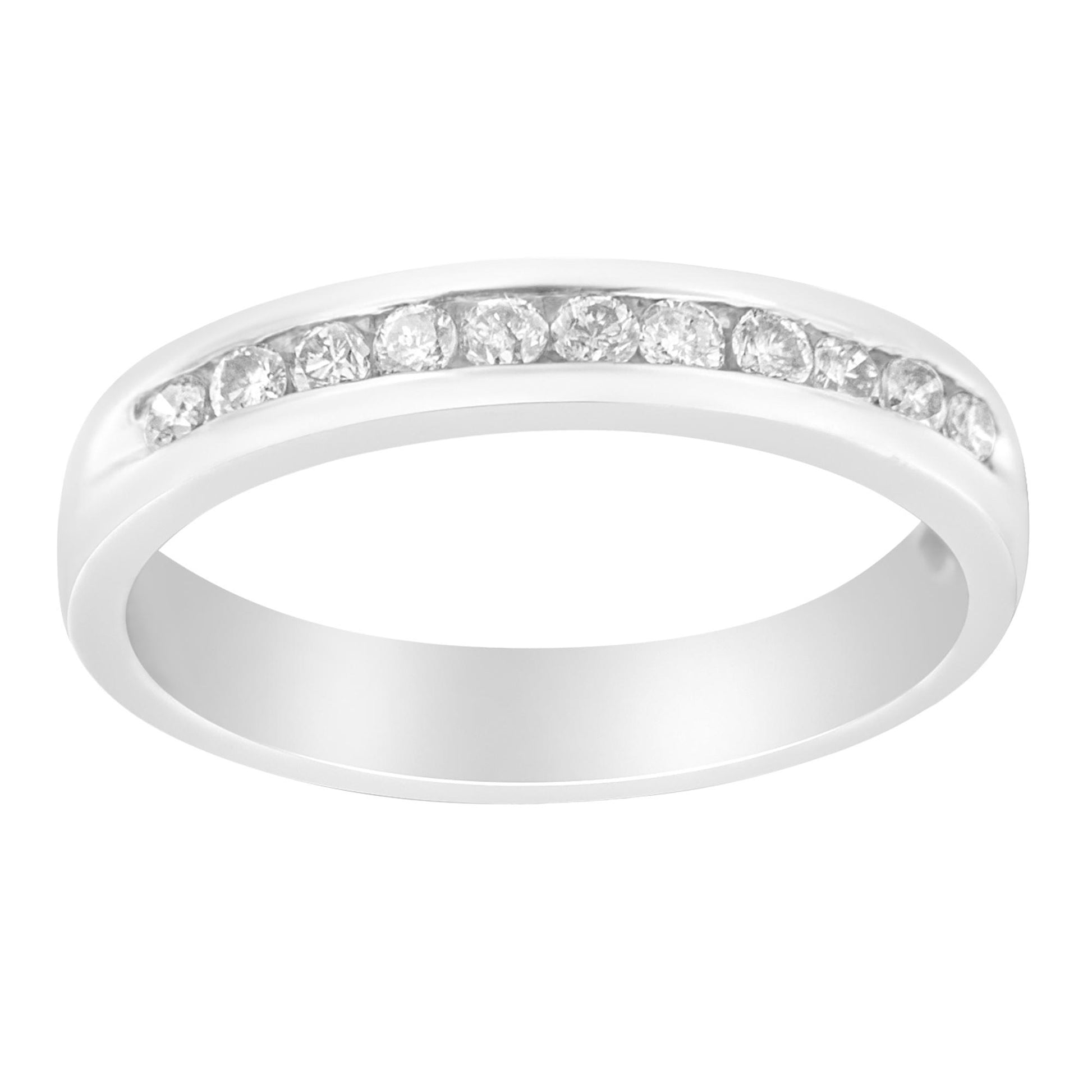 White metal ring with a channel setting of round white gemstones, shown at a slight angle.