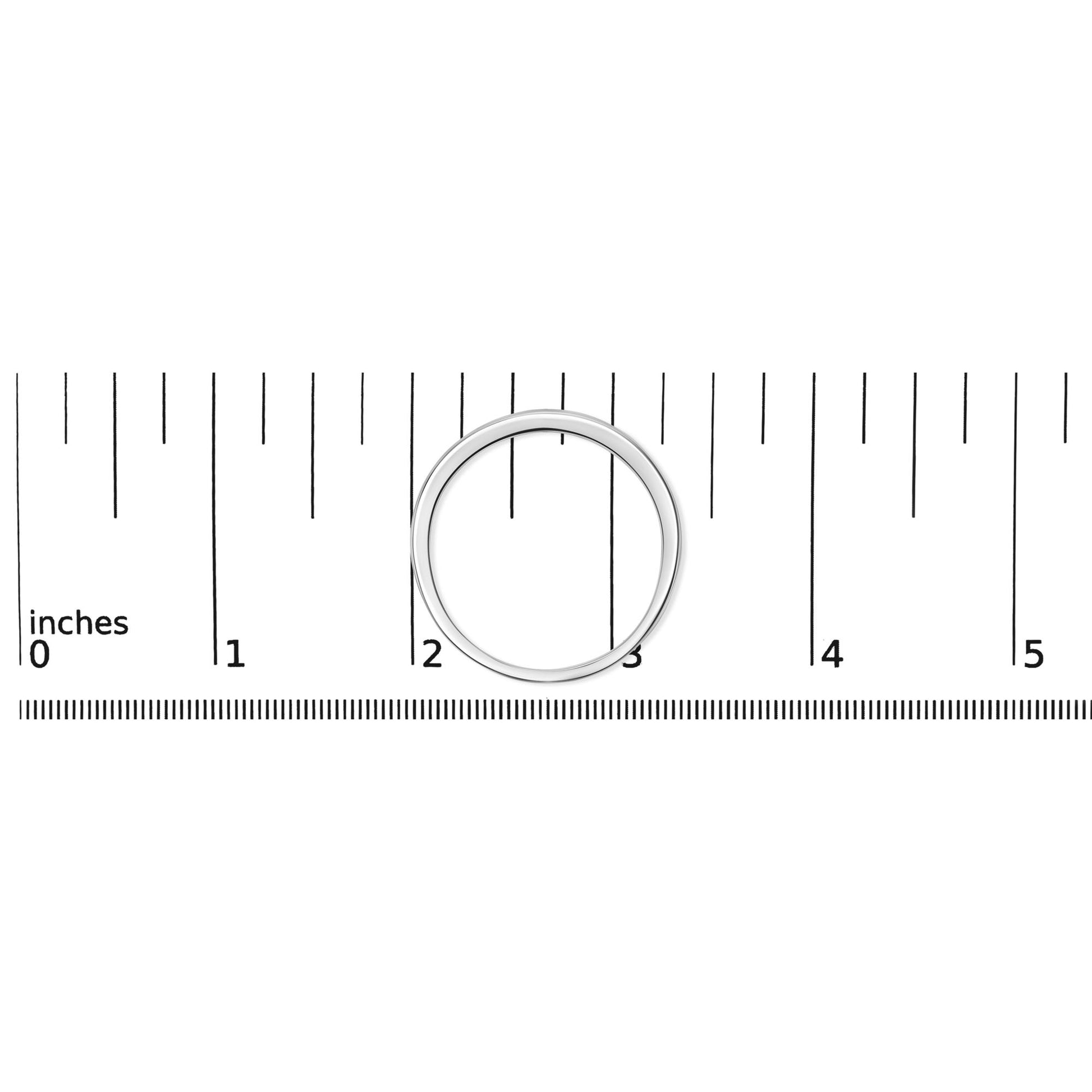 Top-down view of a white metal ring with a channel setting of small round white gemstones, placed on a ruler for size reference.