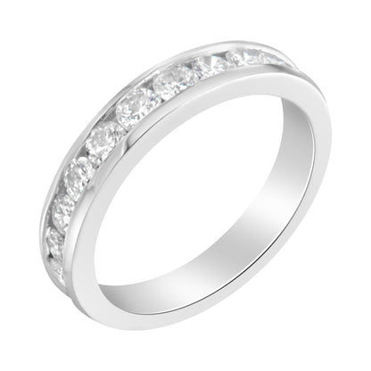 White metal ring with a channel setting of round white gemstones, shown at a slight angle.