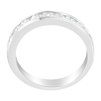 Top-down view of a white metal ring with round white gemstones set in a channel setting around the band.