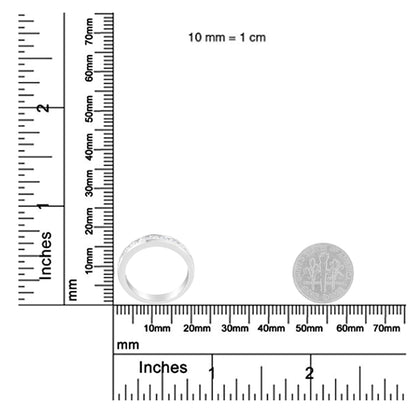 White metal ring with a channel setting of round white gemstones, shown from the front on a ruler for size reference.