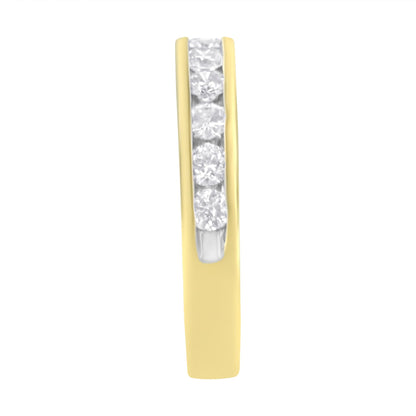 Close-up front view of a yellow metal ring with a channel setting featuring round white gemstones in a vertical row.
