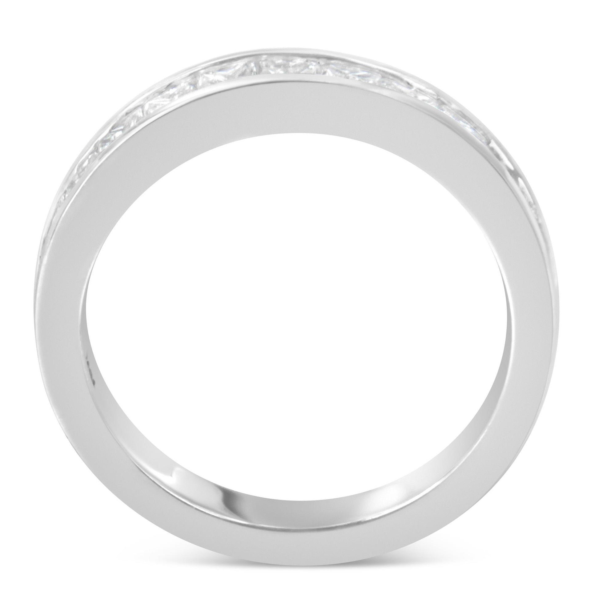 Top view of a white metal ring with a channel setting of princess-shaped white gemstones encircling the band.