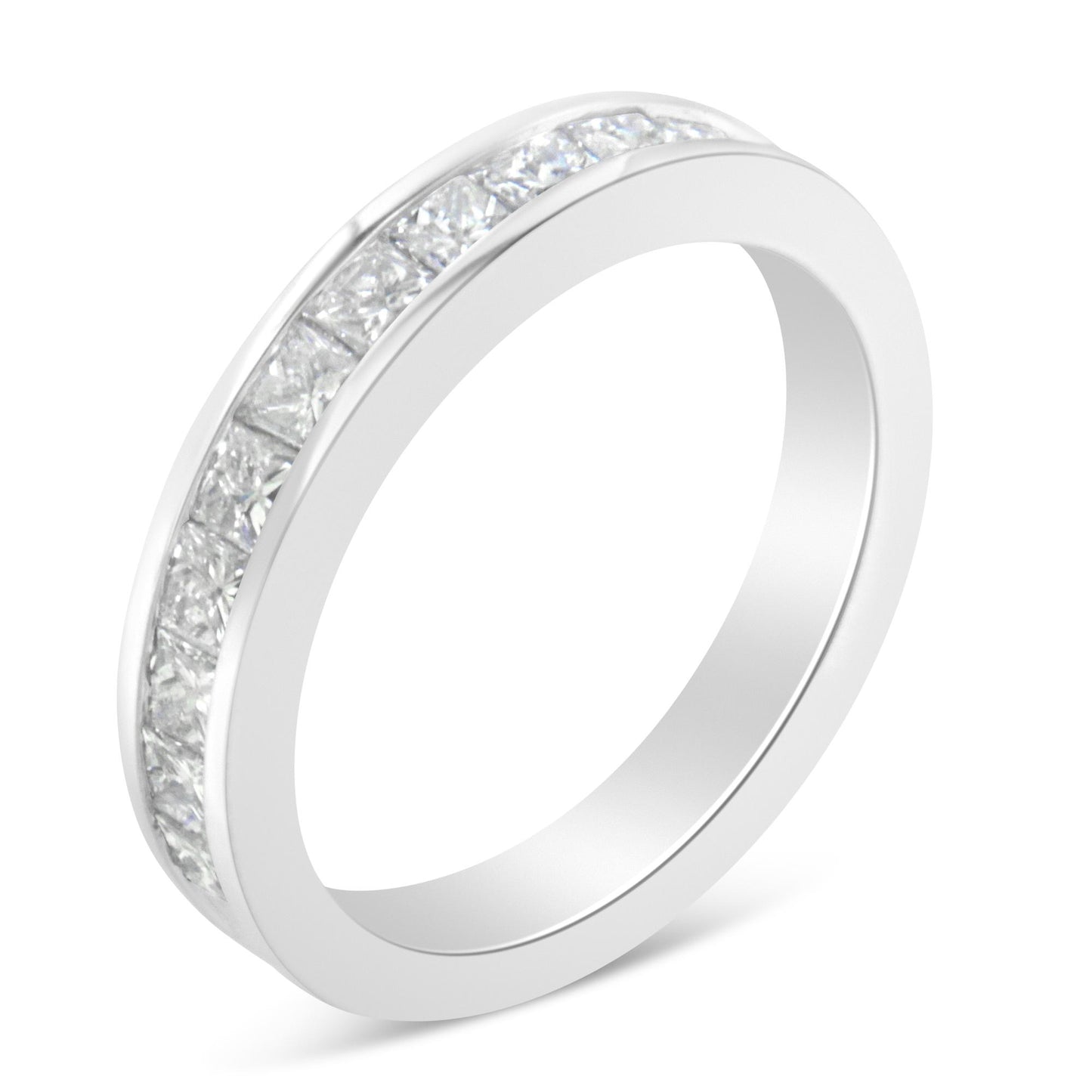 Close-up angled view of a white metal ring featuring a channel setting of princess-shaped white gemstones around the band.