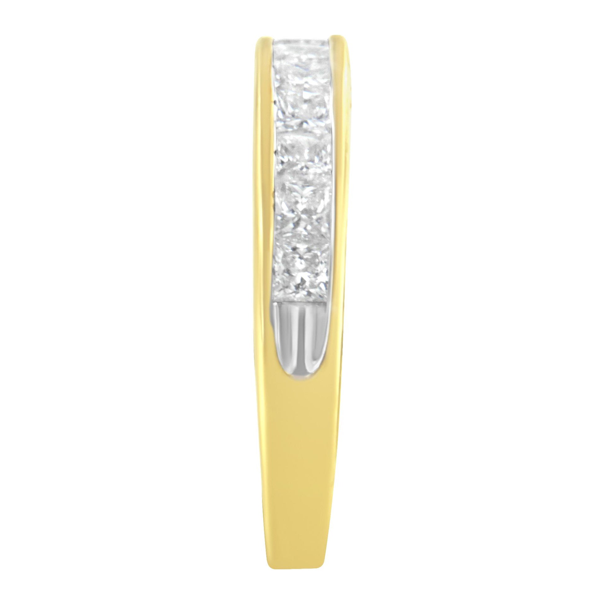 Close-up front view of a yellow band ring with a channel setting of white princess-shaped gemstones in the center.