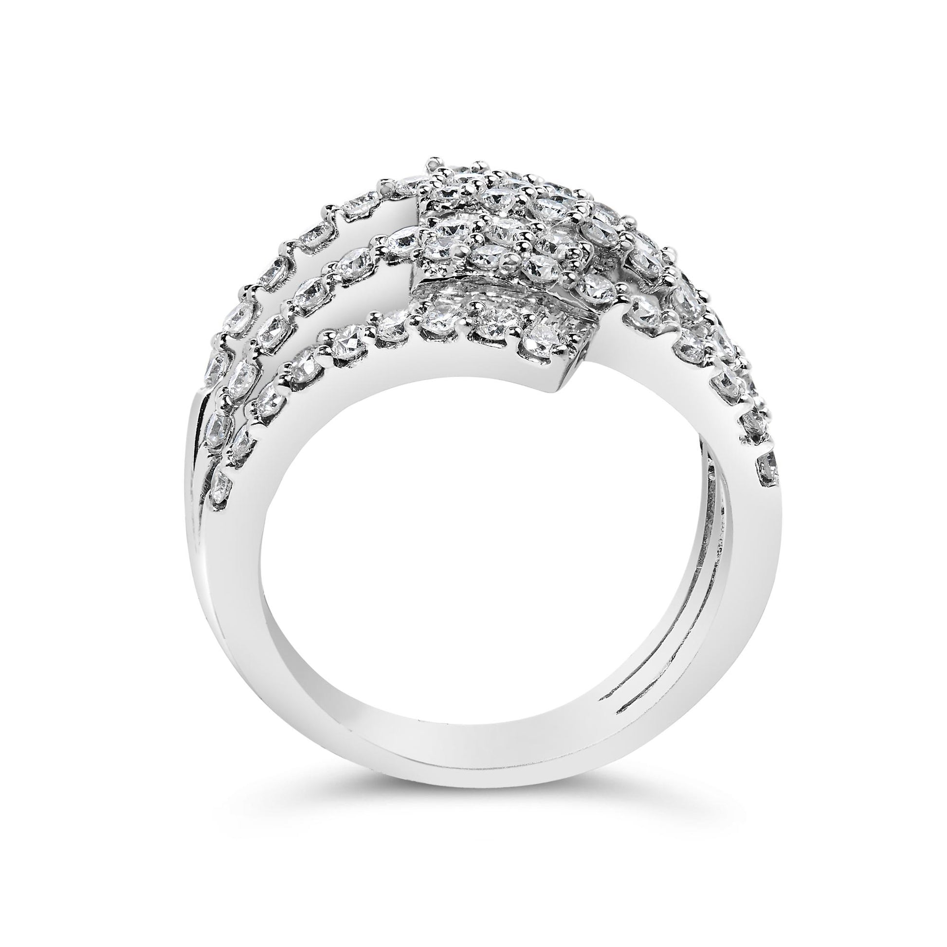 White metal ring with multiple rows of white round gemstones in prong settings and white baguette gemstones in channel settings, shown from the front angle on a white background.