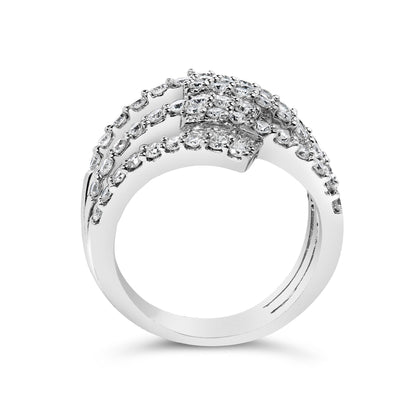 White metal ring with multiple rows of white round gemstones in prong settings and white baguette gemstones in channel settings, shown from the front angle on a white background.