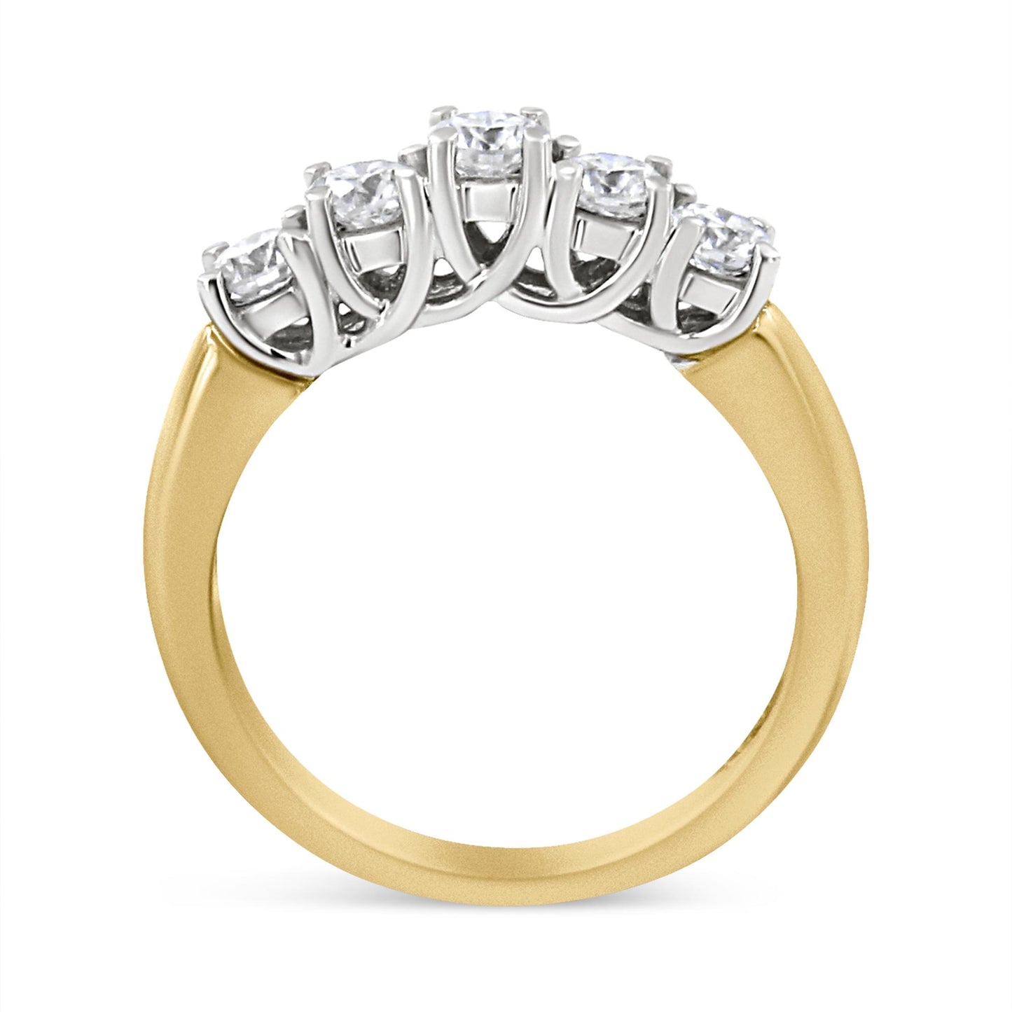 Yellow metal ring with five round white gemstones in prong setting, shown from a side angle.