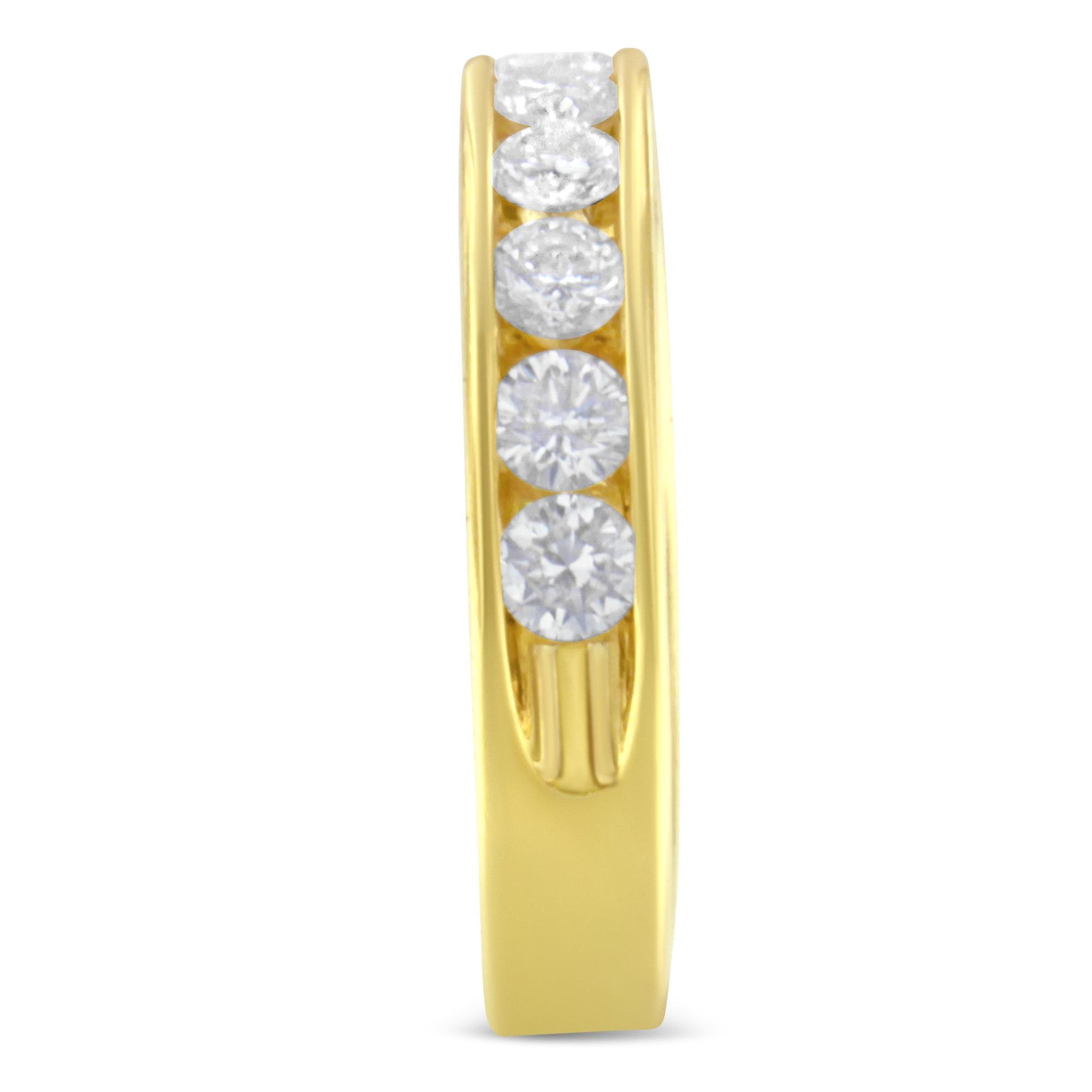 Close-up front angle of a yellow ring with round white gemstones set in a channel setting along the band.
