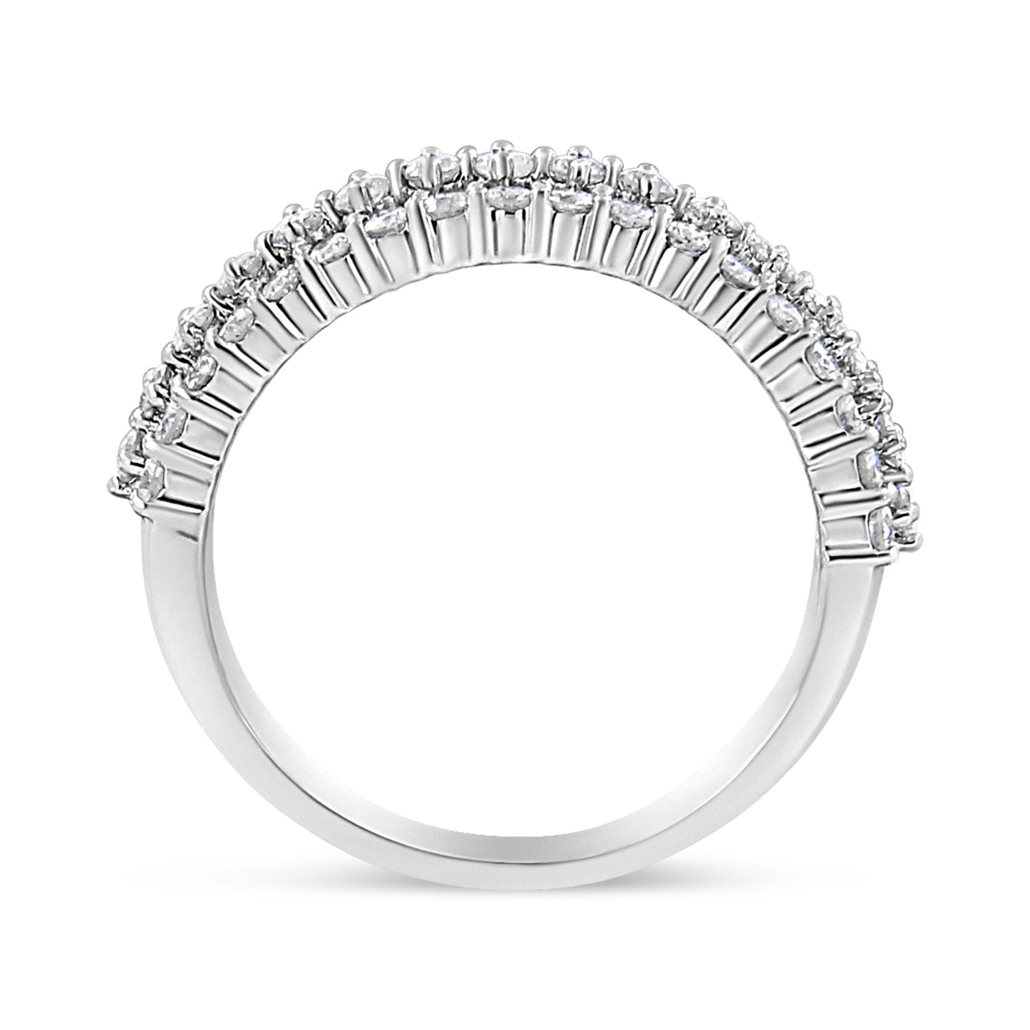 Side angle view of a white metal ring featuring a row of round white gemstones in prong settings along the band.