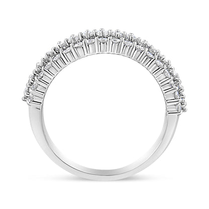 Side angle view of a white metal ring featuring a row of round white gemstones in prong settings along the band.