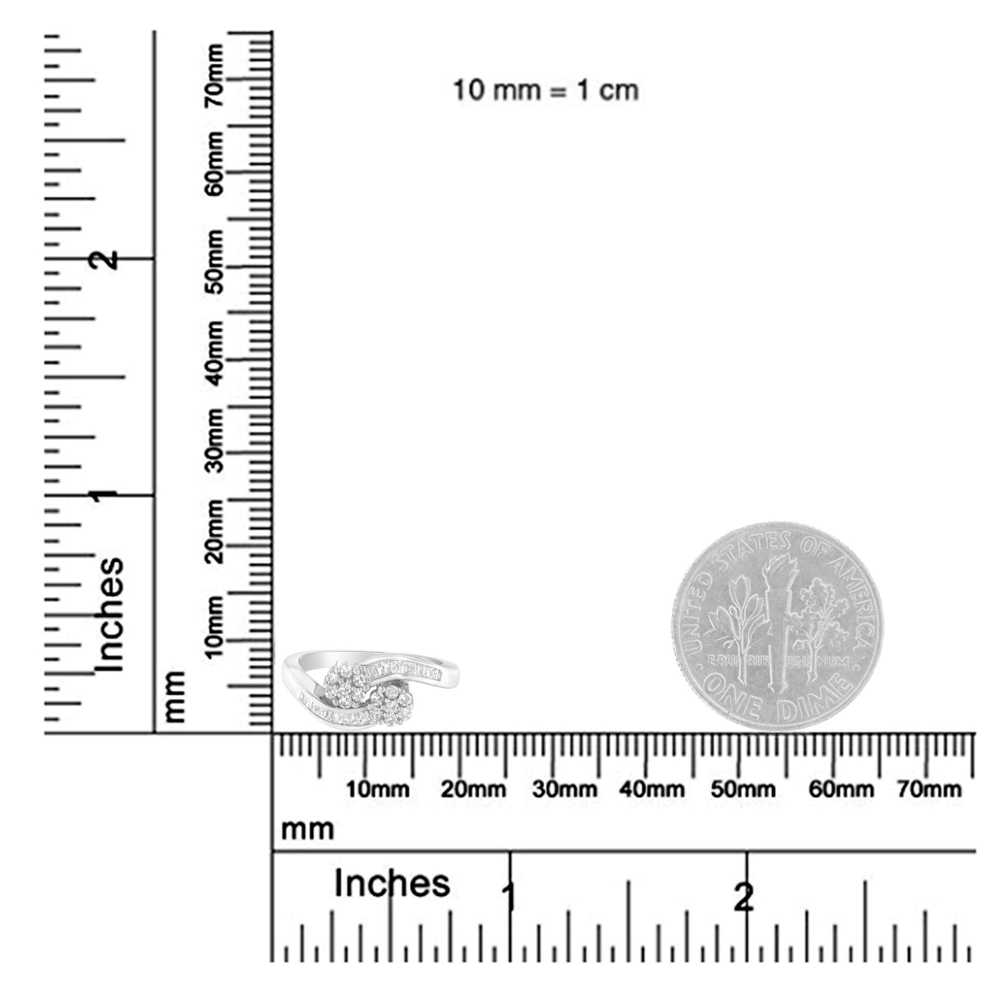 Close-up of a white metal ring on a ruler and scale showing size reference, featuring round and baguette shaped white gemstones in prong and channel settings, shot from a slightly elevated angle.