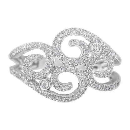 Close-up front angle of a white metal ring with an openwork swirl design, adorned with numerous small white gemstones in prong settings and two larger round white gemstones in bezel settings.