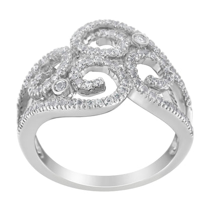 White metal ring with intricate swirling design featuring numerous round white gemstones in prong settings and two round white gemstones in bezel settings, shown from a front angled view.